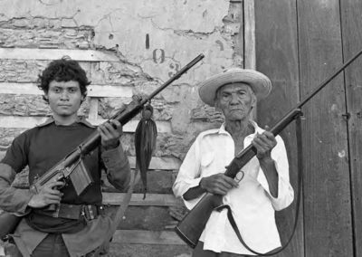 two men holding rifles