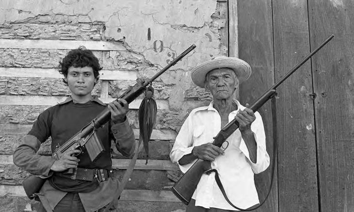two men holding rifles 