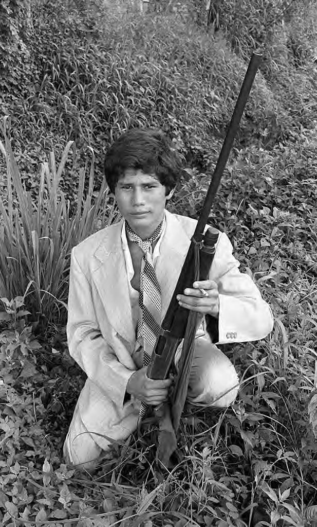 Young man posing with a rifle