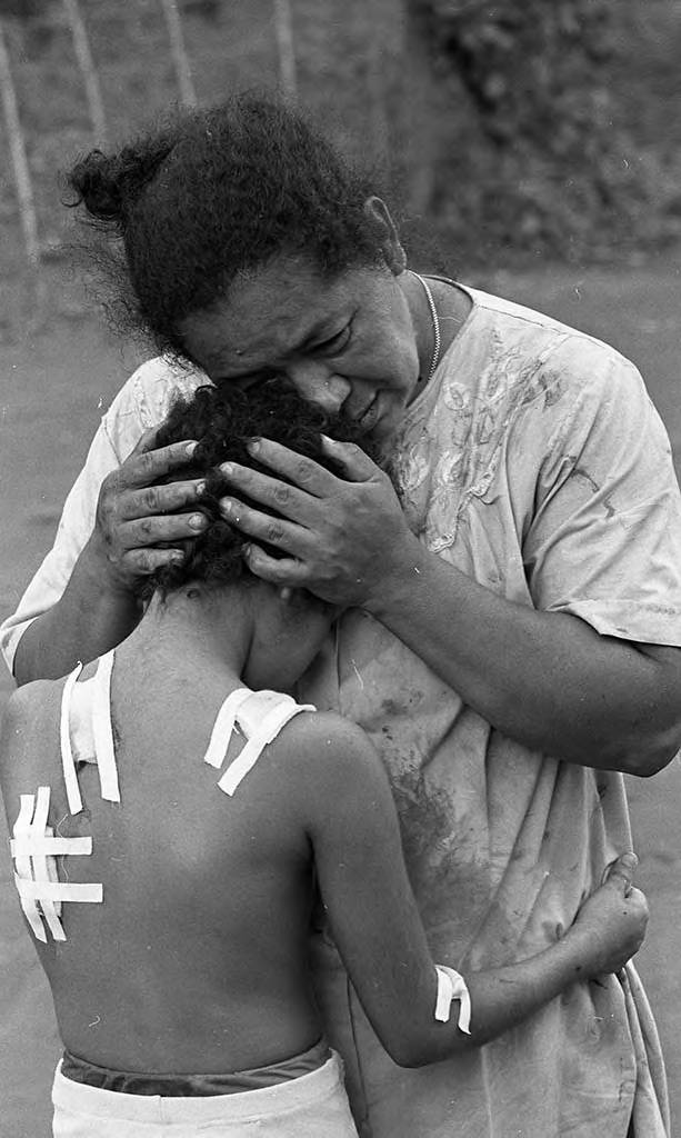 a woman with a child in her arms
