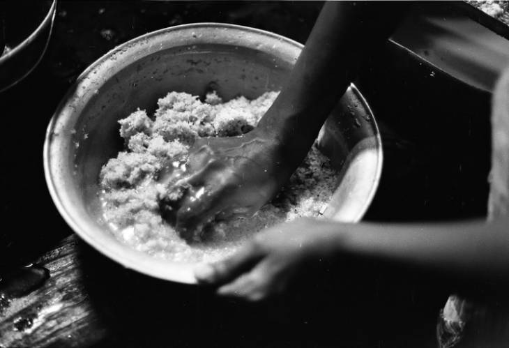 Woman preparing mashed coconut