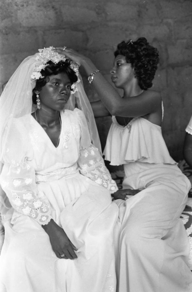 Adjusting bride's veil