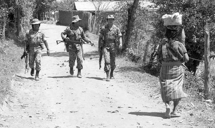 Soldiers on patrol in a village