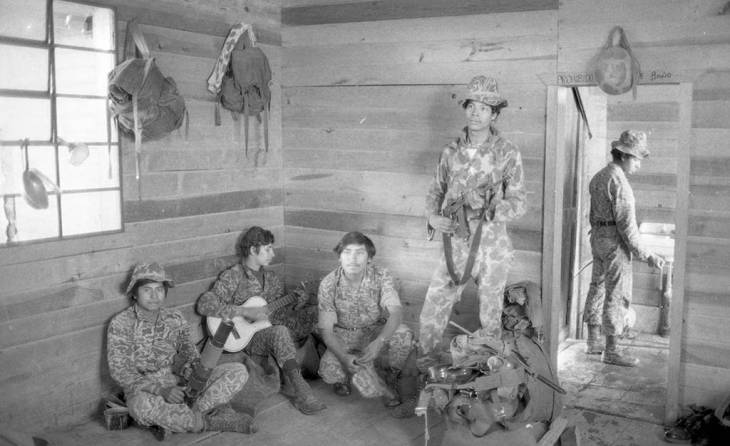 Young soldiers inside a house,