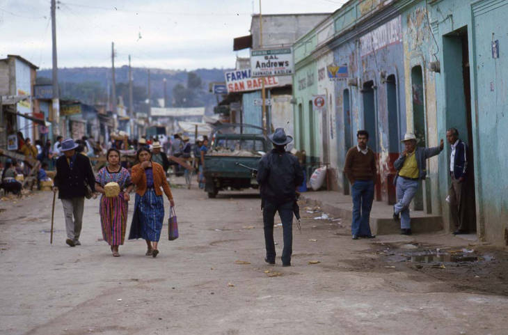 Mayan women walk through a busy Chimaltenango street