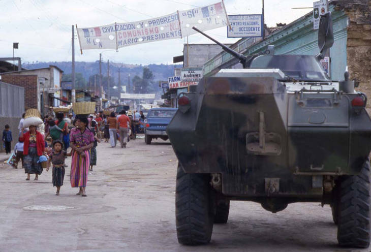 An armored car and civilians,